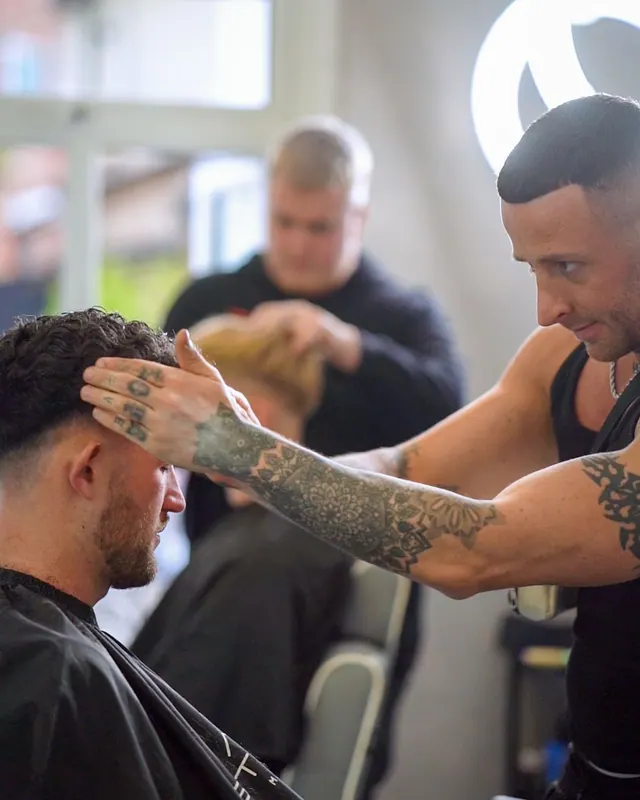 The barbers at work at ACM Studios